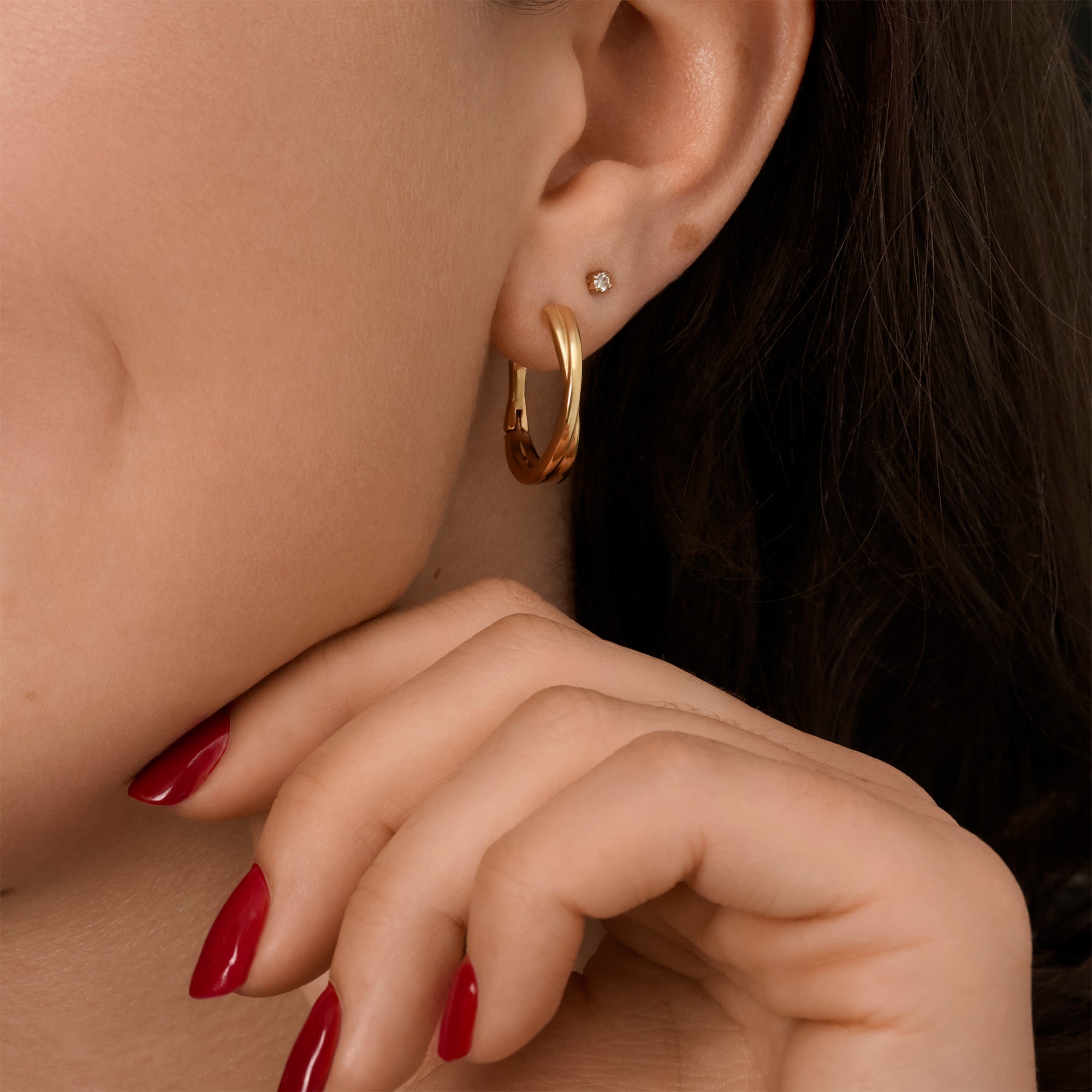 Gold stainless steel hoop earrings with minimalist smooth design, hypoallergenic earrings for sensitive ears, non-tarnish waterproof durable everyday jewelry, modern affordable luxury jewelry Canada.