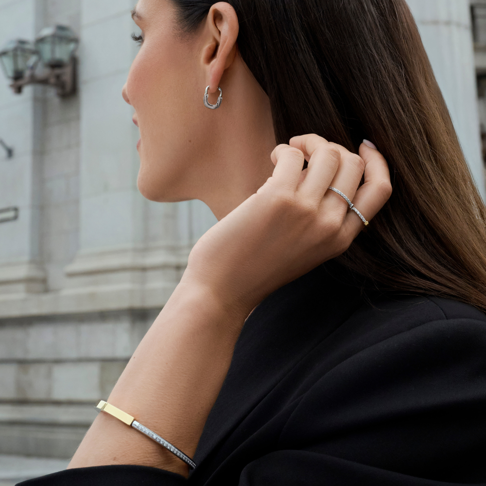 Silver stainless steel hoop earrings with cubic zirconia pavé rings and two-tone gold and silver bangle bracelet, minimalist elegant jewelry, hypoallergenic non-tarnish durable everyday jewelry Canada.
