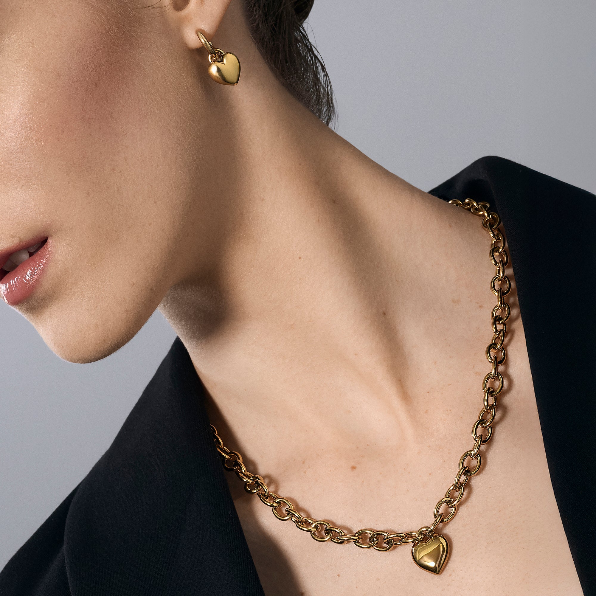 Gold chunky chain necklace with puffy heart charm paired with gold heart huggie earrings – nickel-free, waterproof & tarnish-resistant stainless steel jewelry set for women by Mia Bijoux Canada