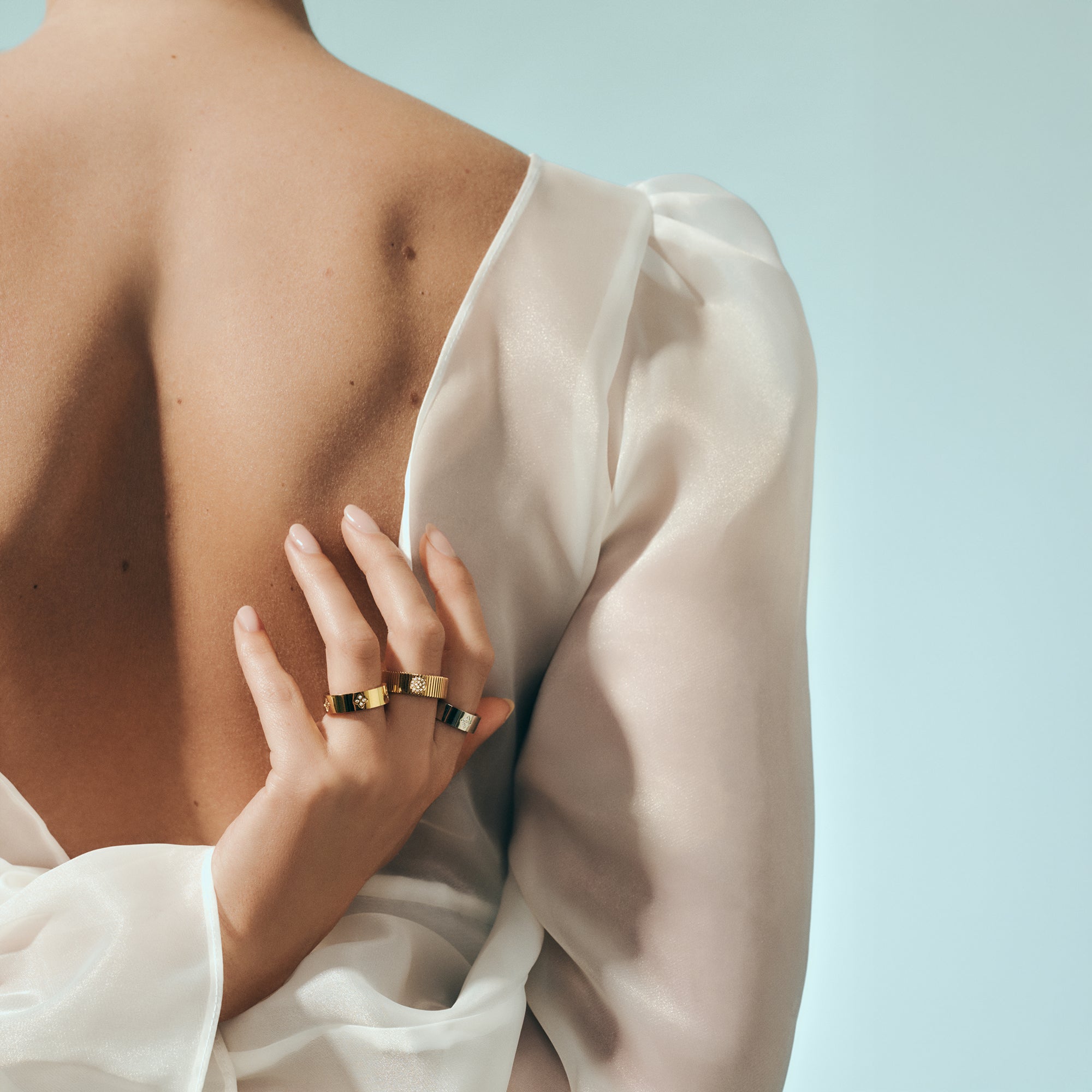 Gold ribbed band ring with round pavé detail in surgical stainless steel, hypoallergenic jewelry for sensitive skin, tarnish free and safe.