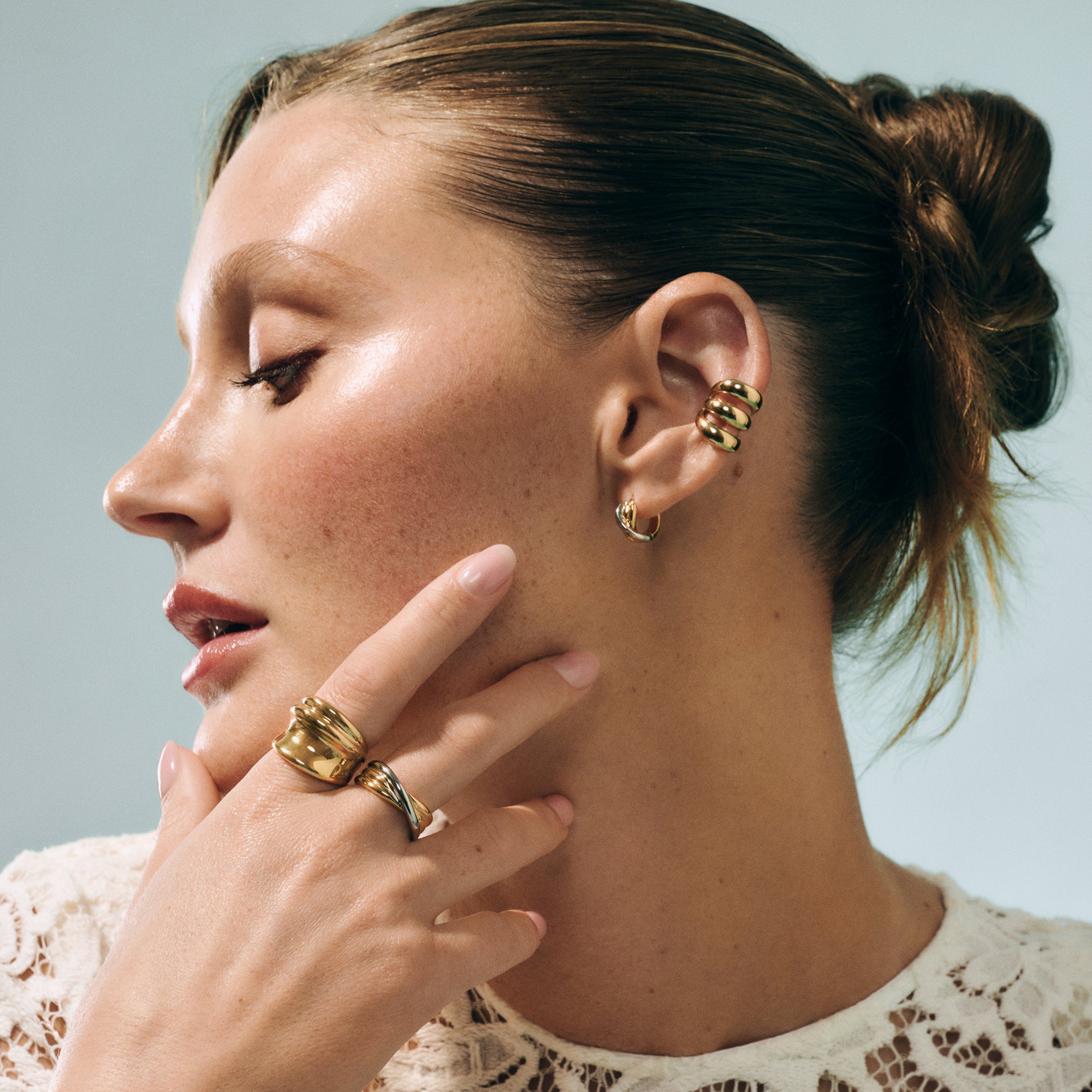 Gold triple-band ear cuff in surgical stainless steel, top-rated and best for sensitive ears, allergy-free and hypoallergenic, waterproof, non tarnish, safe and designed to prevent skin irritation.