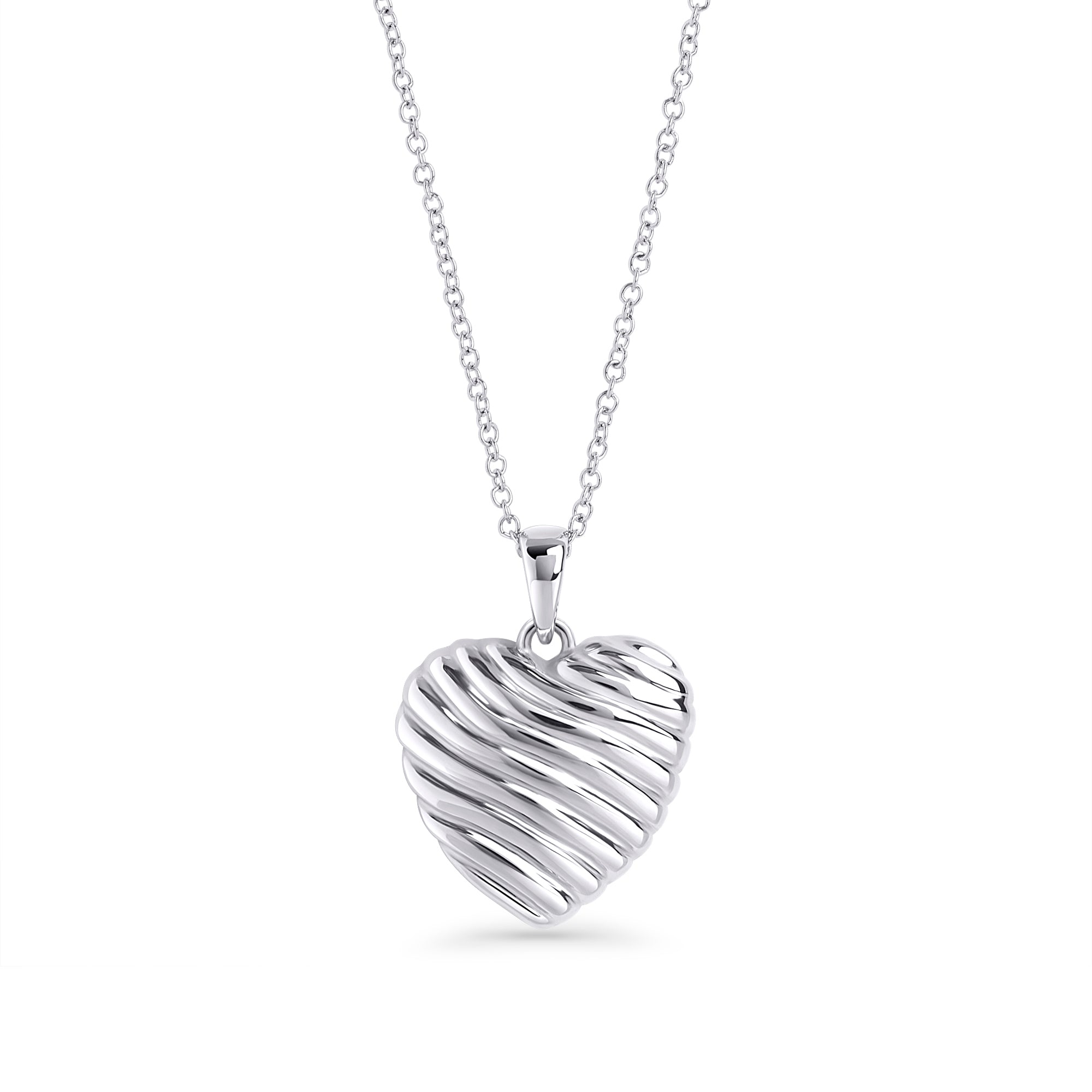 Silver stainless steel ribbed heart pendant necklace close-up, sculptural romantic jewelry design, hypoallergenic non-tarnish durable statement necklace, modern elegant heart jewelry.
